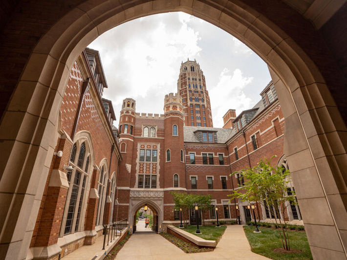 Look through an archway on campus